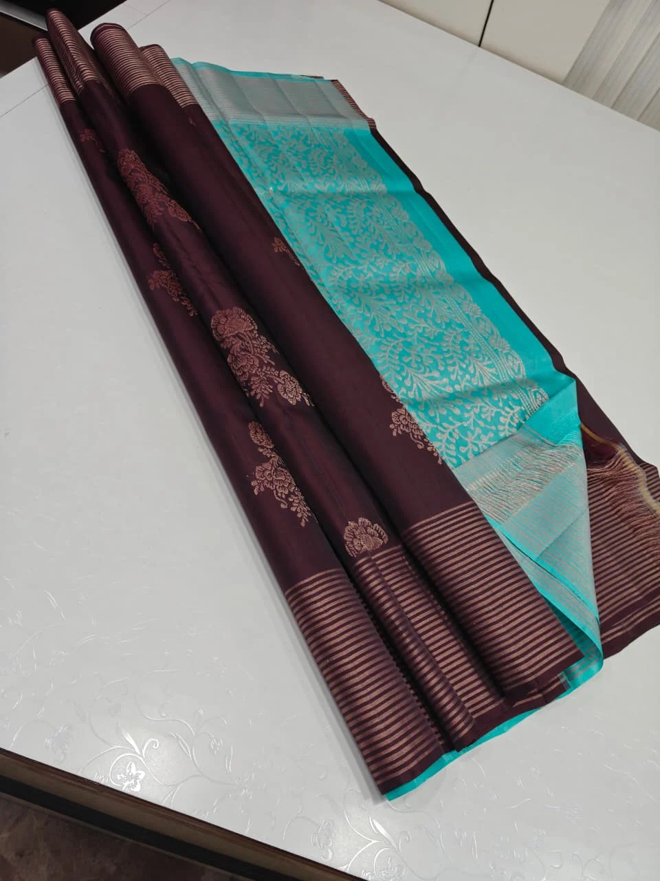 Coffee Brown and Turquoise Blue Soft Silk with Rose Bunch Butta and Copper Stripe Border Saree
